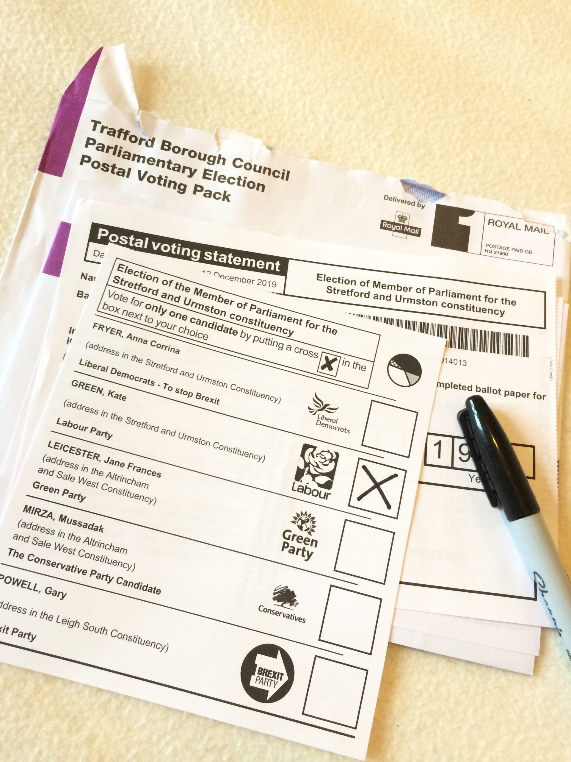 A photo of a postal vote ballot paper for the UK parliamentary elections in 2019. The box next to the Labour candidate has been marked with an 'X'.