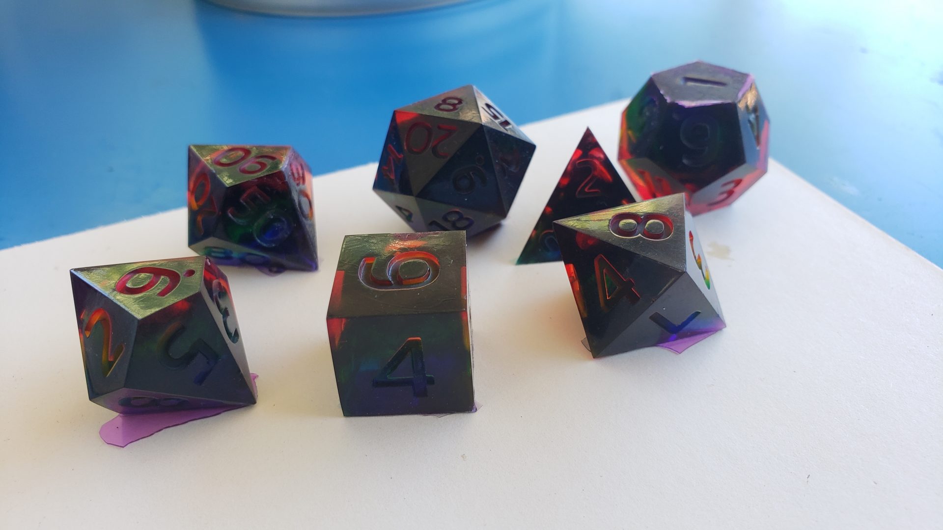 A picture of several dice (or die) lay out on a tabletop