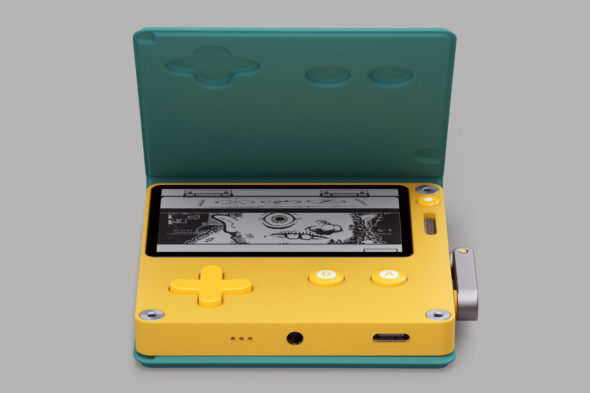 An image swiped from the media kit of the Playdate. It shows a Playdate console lay flat on a surface yet housed in a green cover that magnetically attaches to the back of the small yellow console, and folds over the top, clasping down at the front.