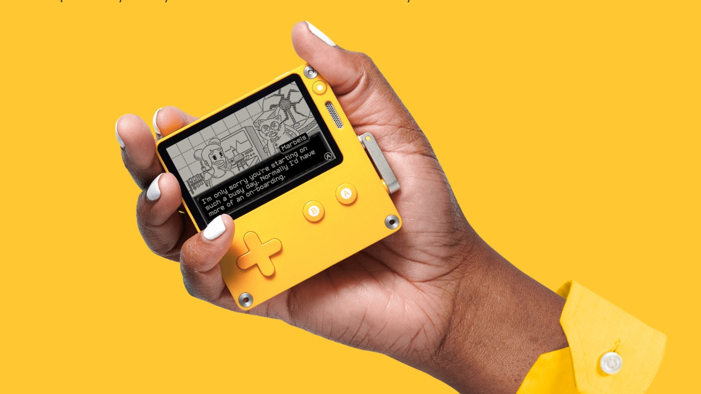A promo photo of the Playdate handheld console on a yellow backdrop.